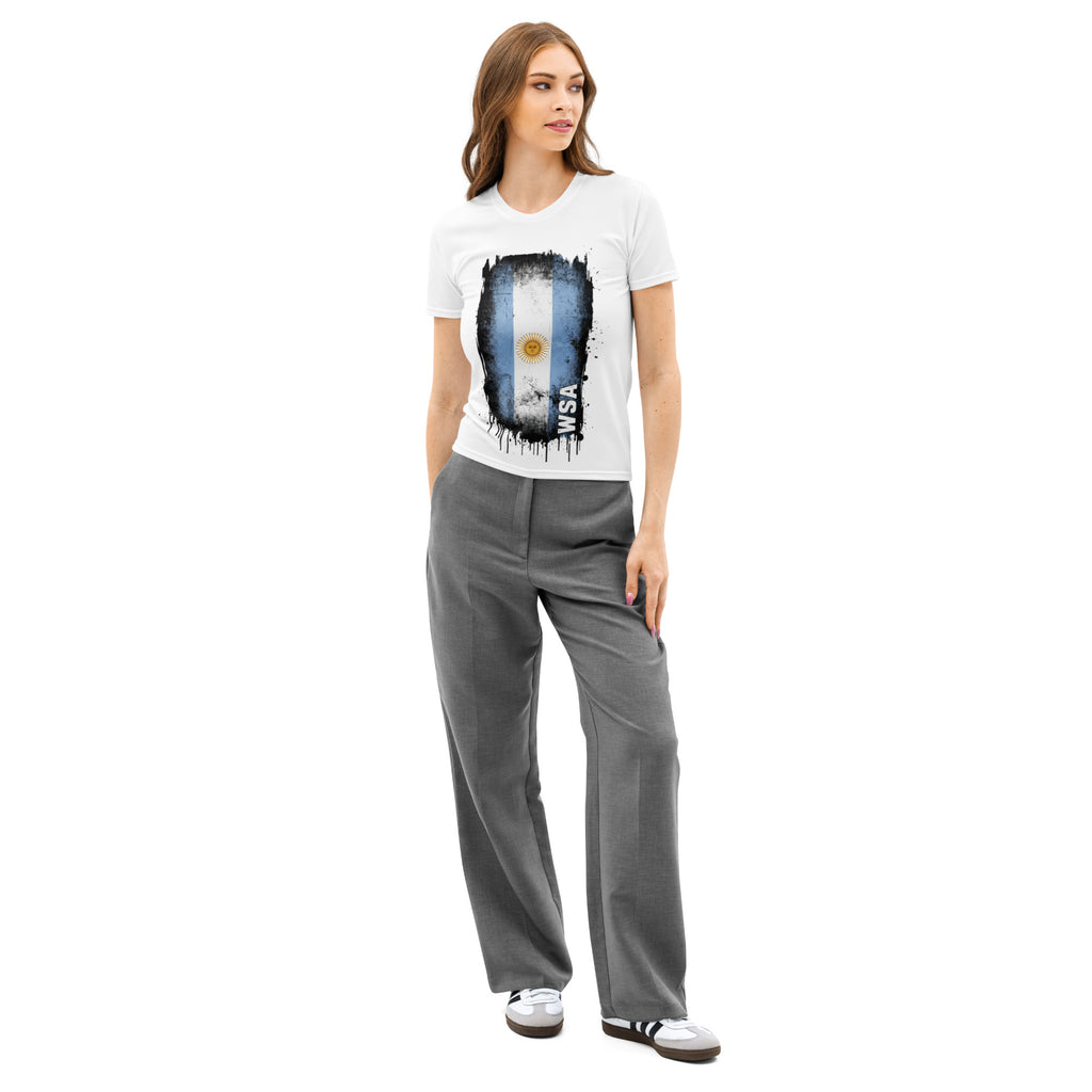 Woman wearing a white t-shirt with a graphic design and gray pants on a white background