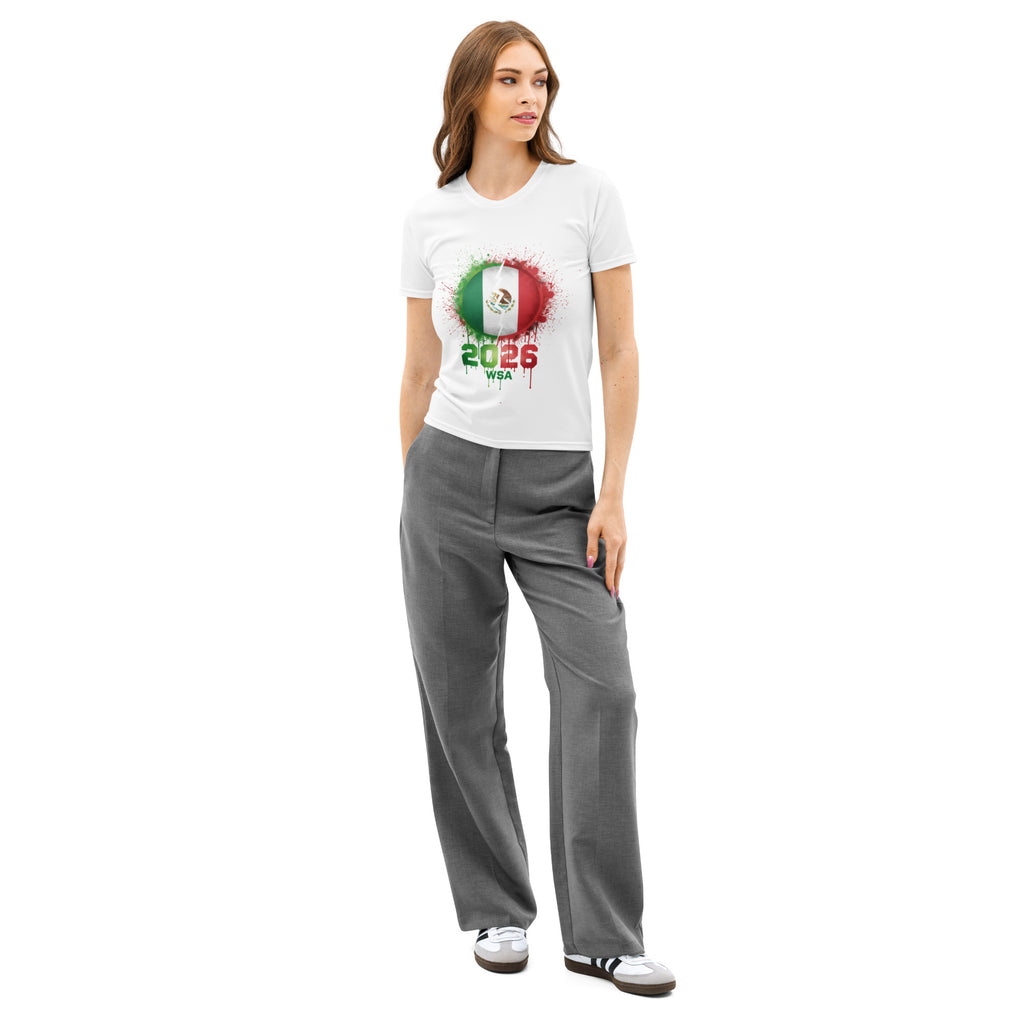 Woman wearing a white t-shirt with a colorful graphic and text, paired with gray pants on a white background