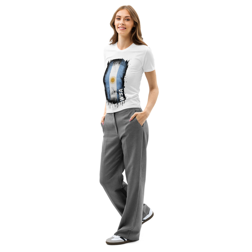 Woman wearing a white t-shirt with a graphic design and gray pants on a white background