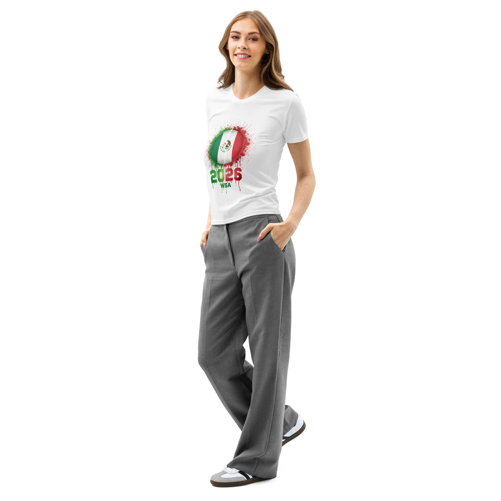Woman wearing a white t-shirt with a graphic design and gray pants on a white background