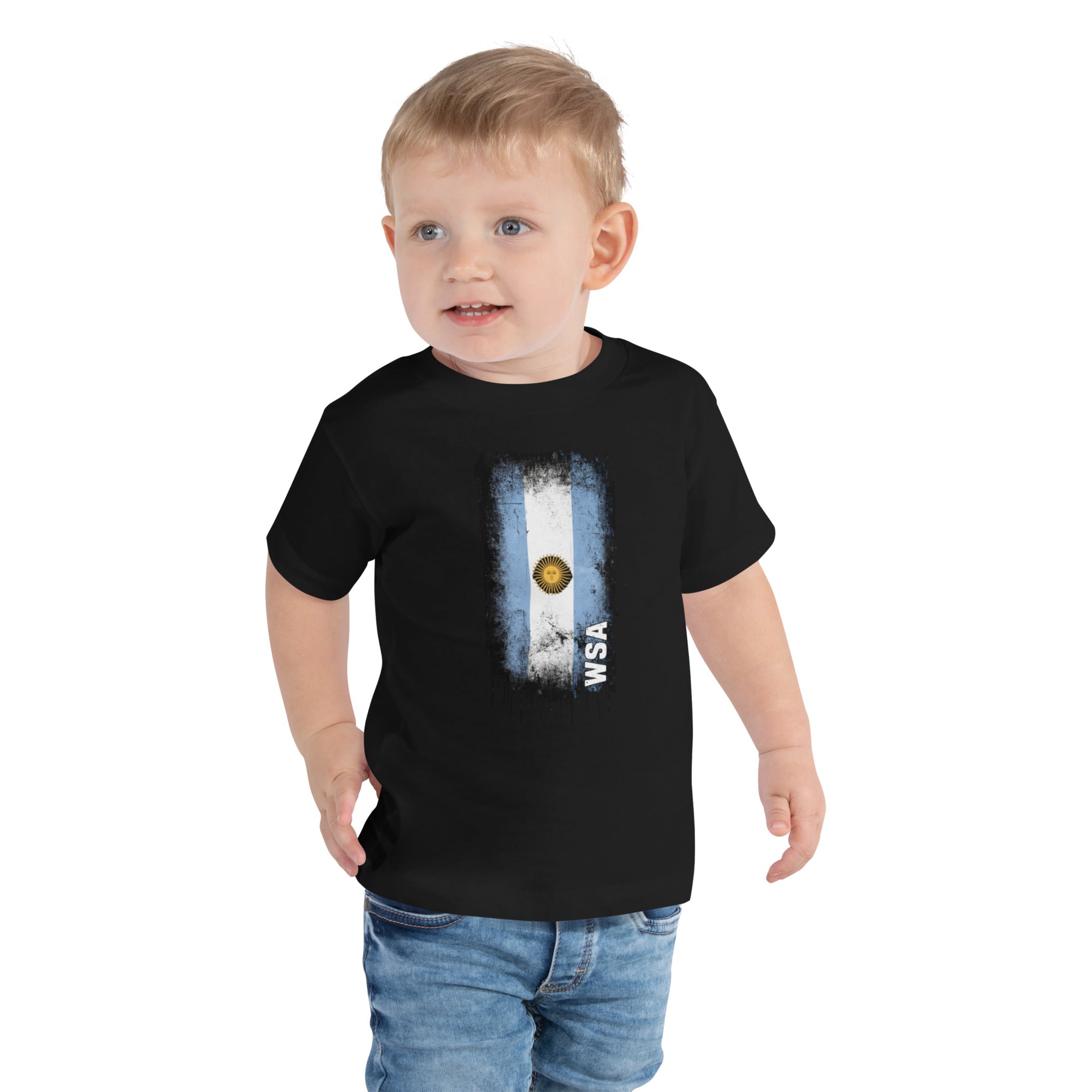 Child wearing a black t-shirt with a flag design on a white background