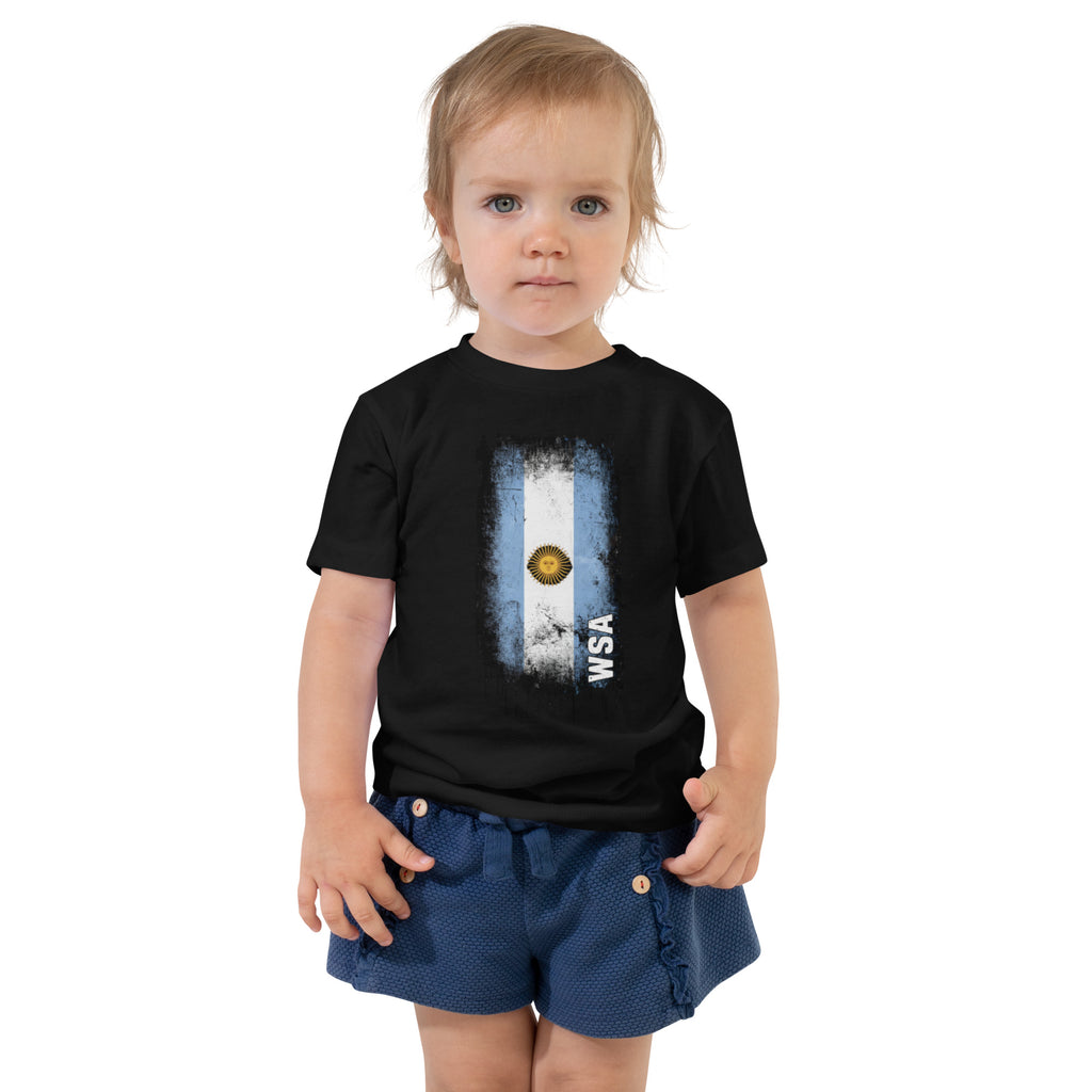 Child wearing a black t-shirt with a flag design on a white background