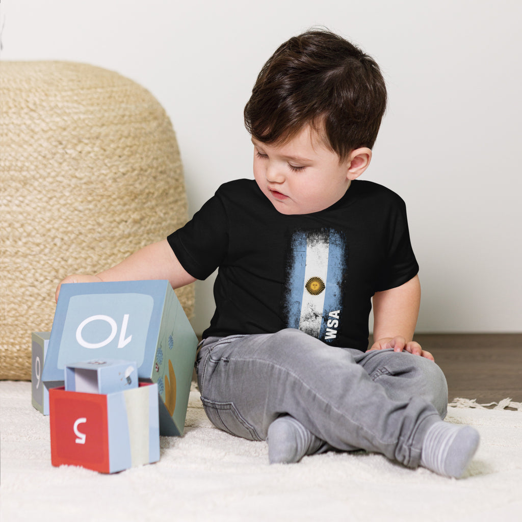 Child playing with educational blocks on a carpeted floor.