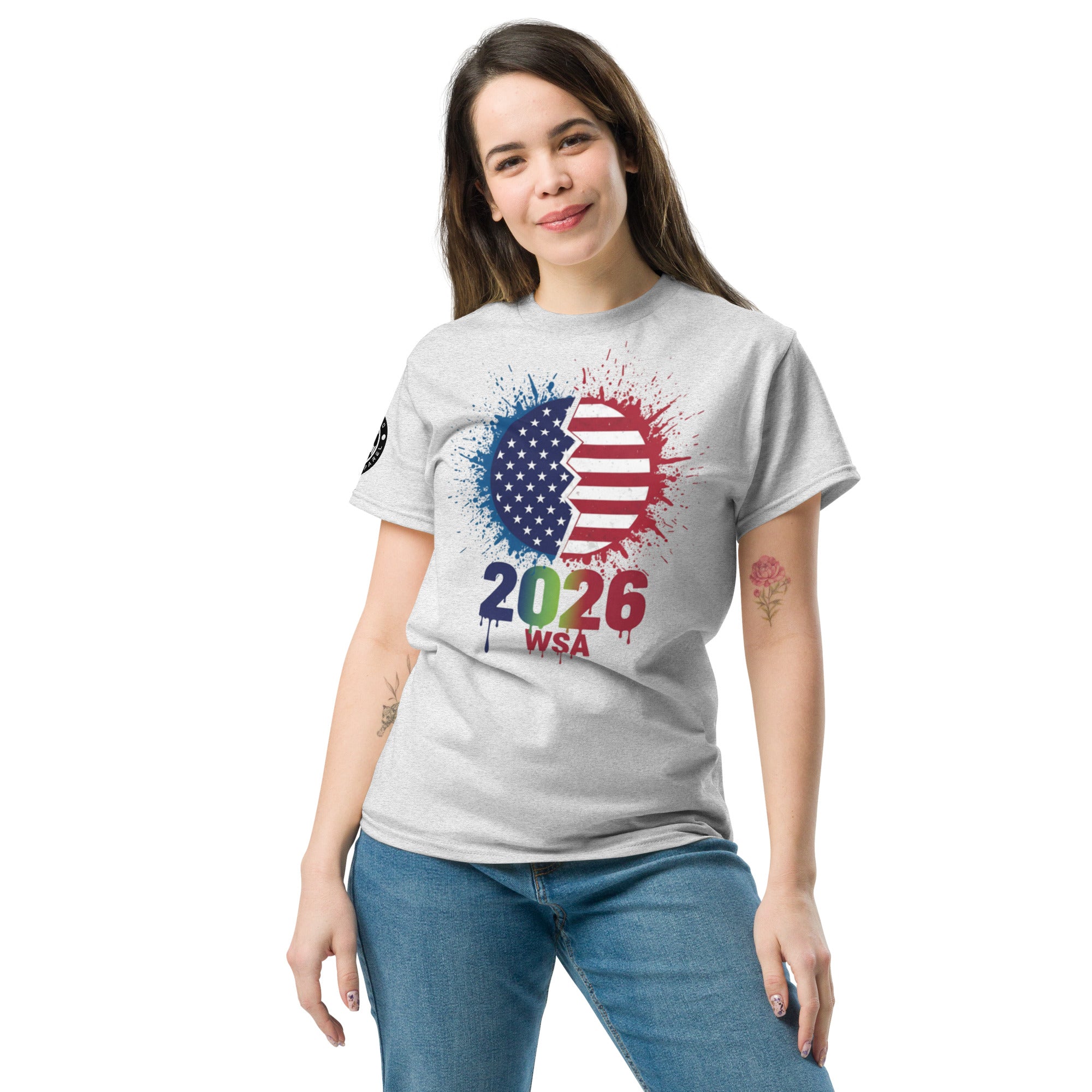 Woman wearing a gray t-shirt with a colorful design featuring '2026 WSA' on a white background