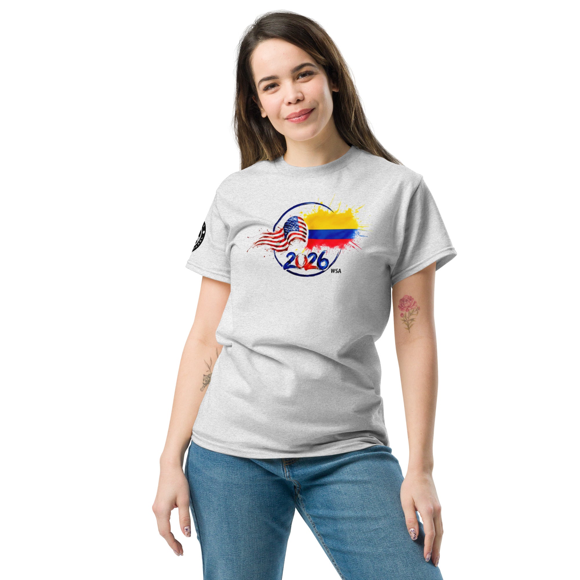 Woman wearing a gray t-shirt with a colorful graphic design on a white background