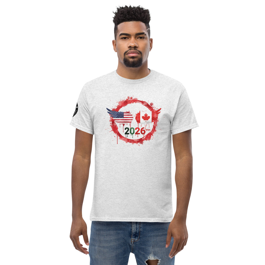 Man wearing a white t-shirt with a graphic design featuring the American and Canadian flags and the year 2026 on a white background.