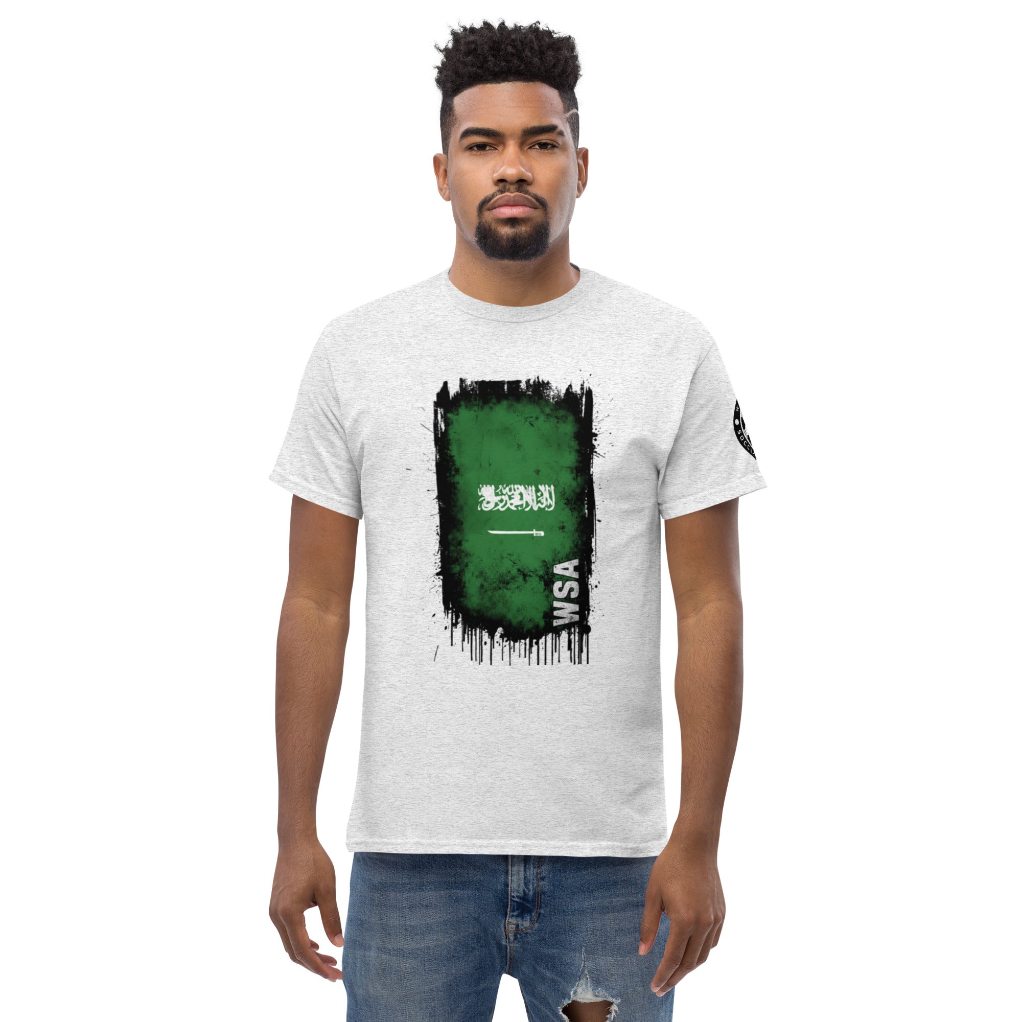 Man wearing a white t-shirt with a green and black graphic design on a white background