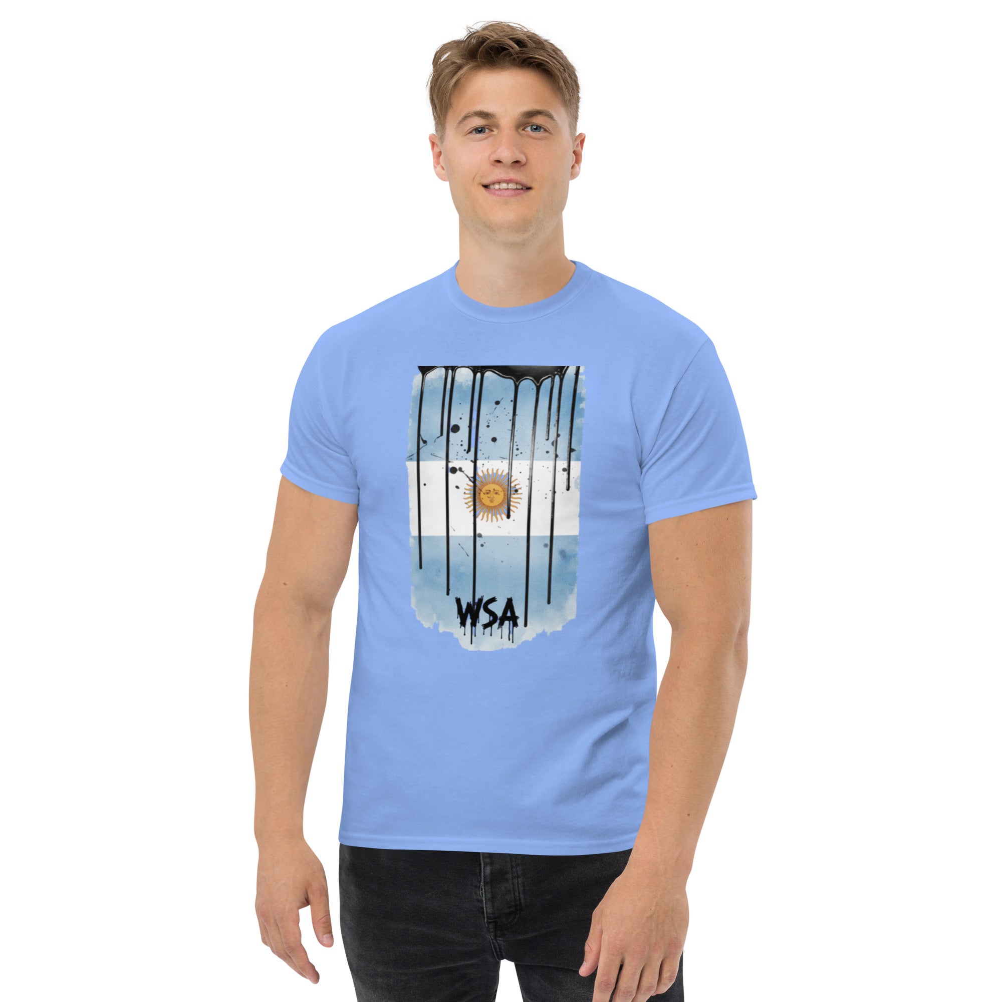 Person wearing a light blue t-shirt with a graphic design on a white background