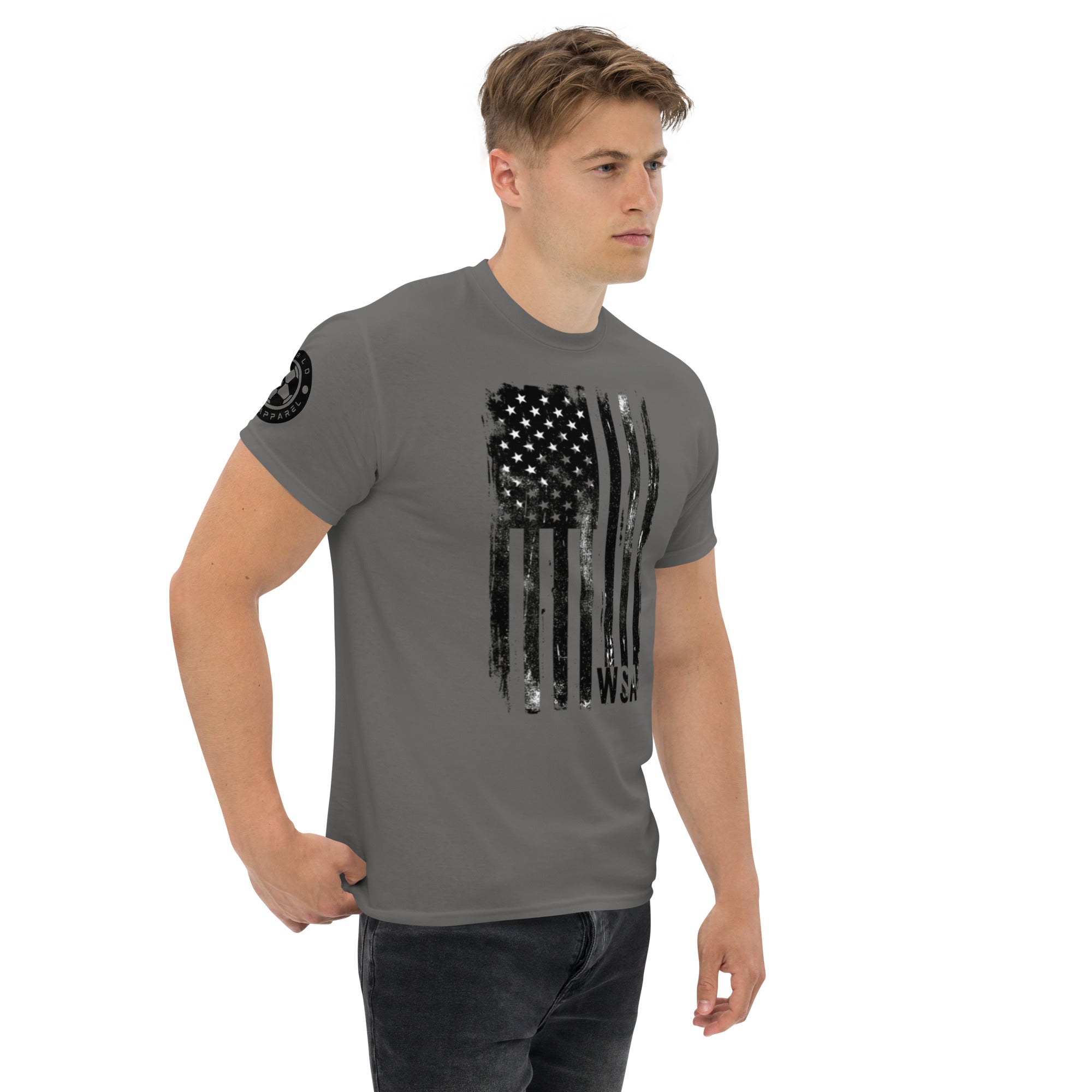 Man wearing a gray t-shirt with a black flag design on a white background
