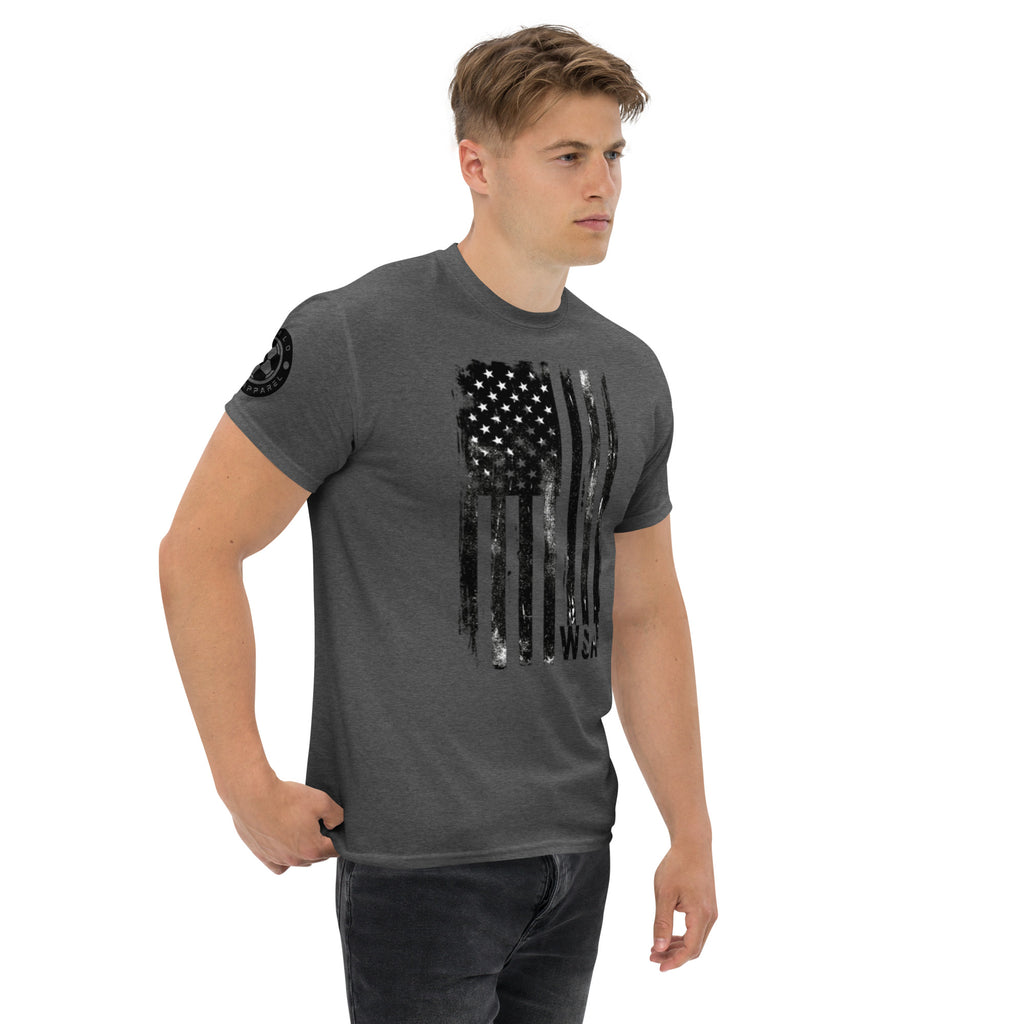Man wearing a gray t-shirt with a black and white graphic design on a white background