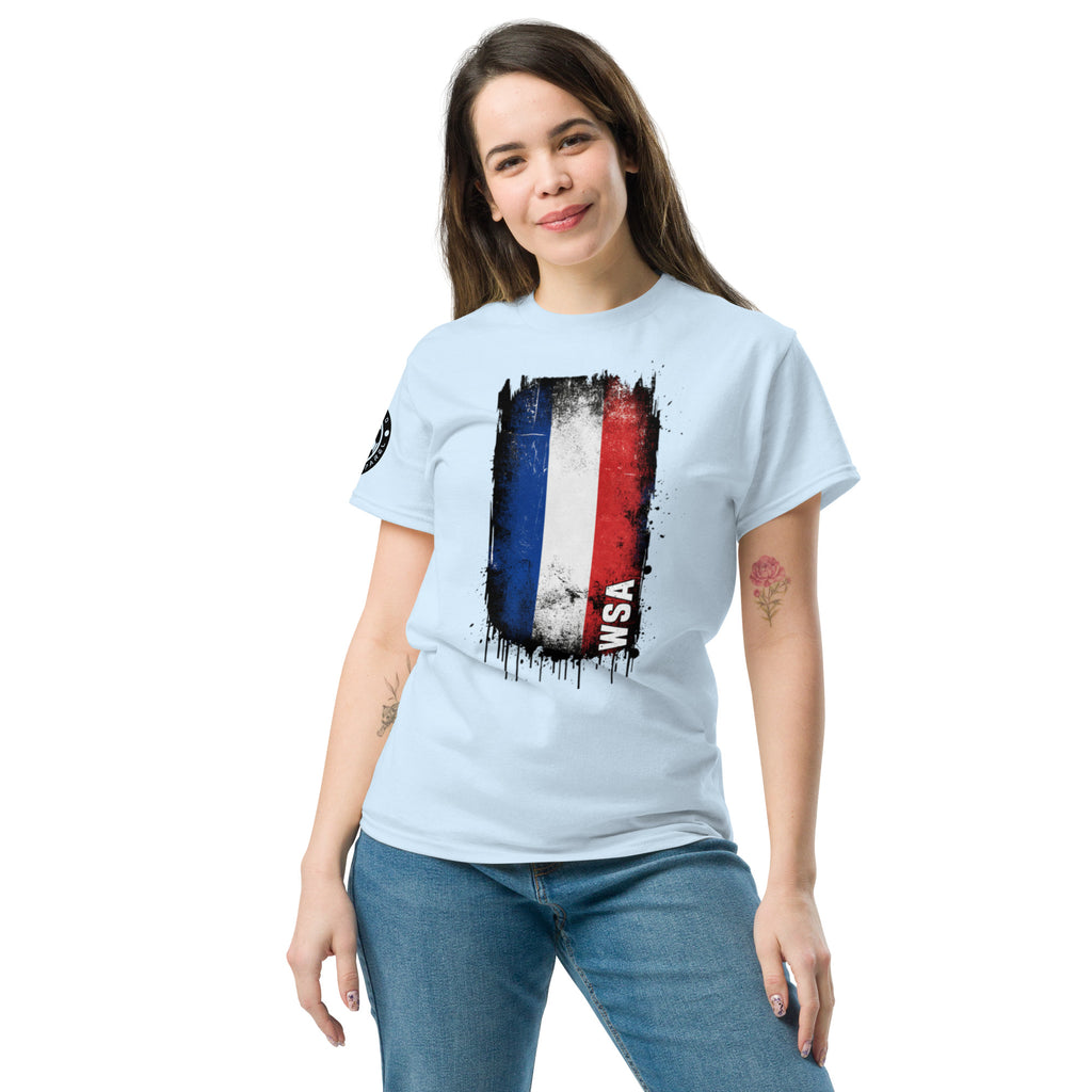 Woman wearing a light blue t-shirt with a graphic design on a white background