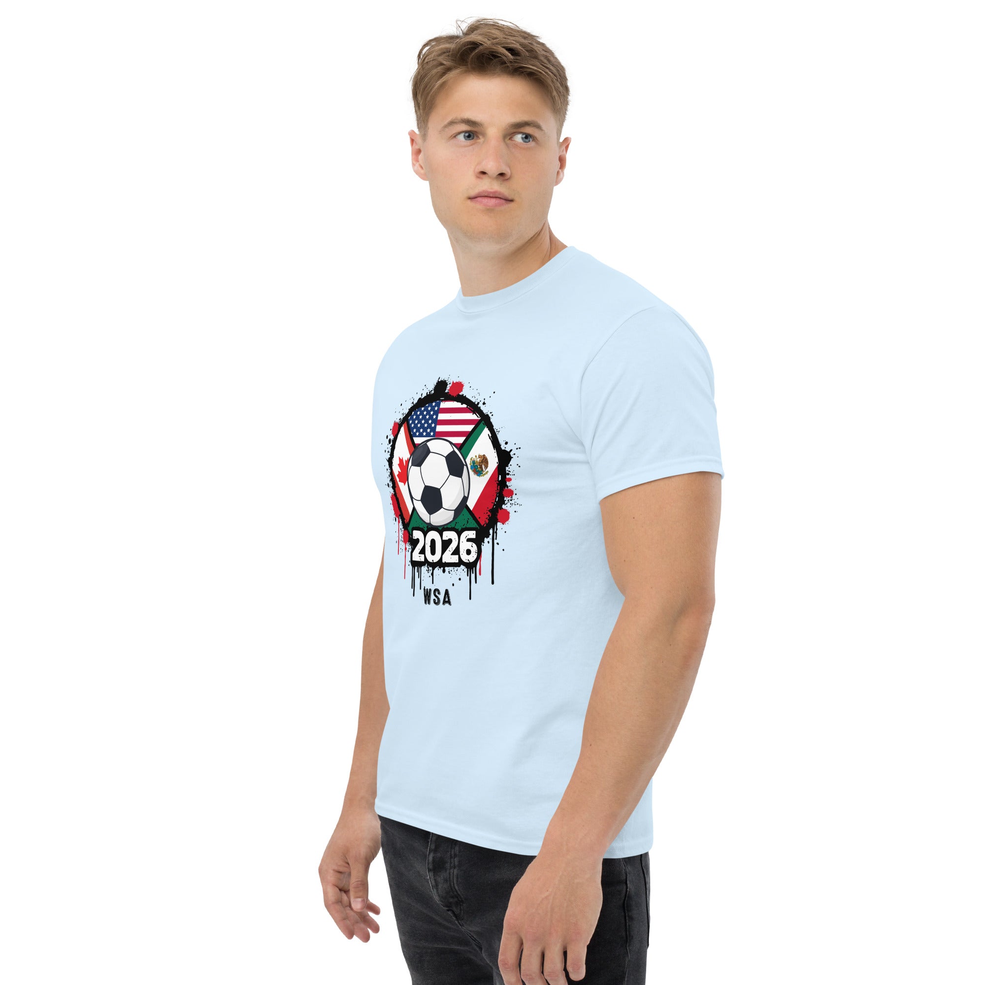 Man wearing a light blue t-shirt with a soccer-themed design on a white background