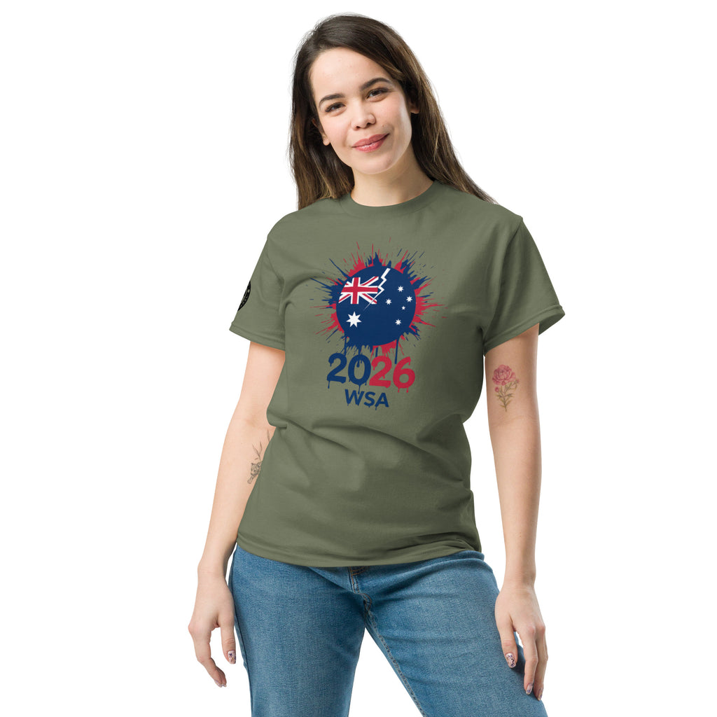 Woman wearing a green t-shirt with a design featuring the number 2026 and text on a white background