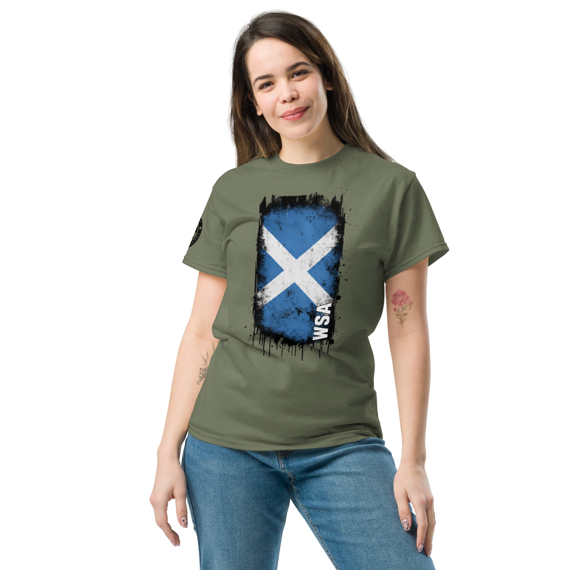 Woman wearing a green t-shirt with a blue and white flag design on a white background