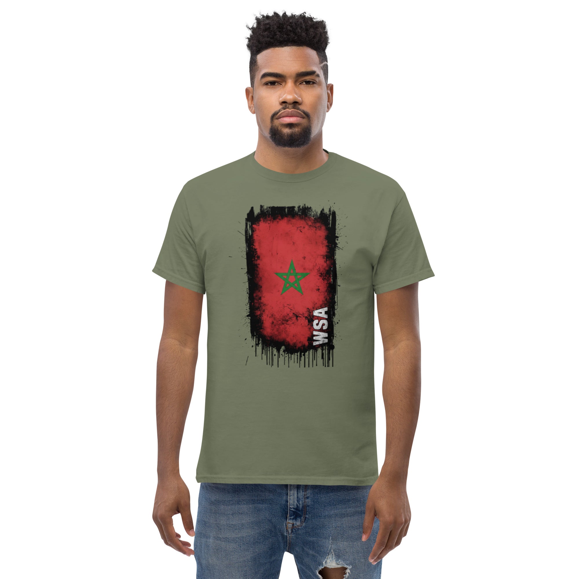 Man wearing a green t-shirt with a red and black graphic design on a white background