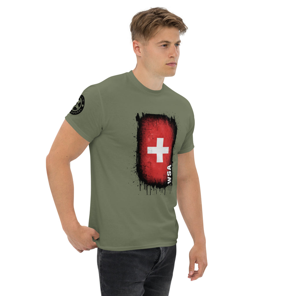 Man wearing a green t-shirt with a red and black graphic design on a white background