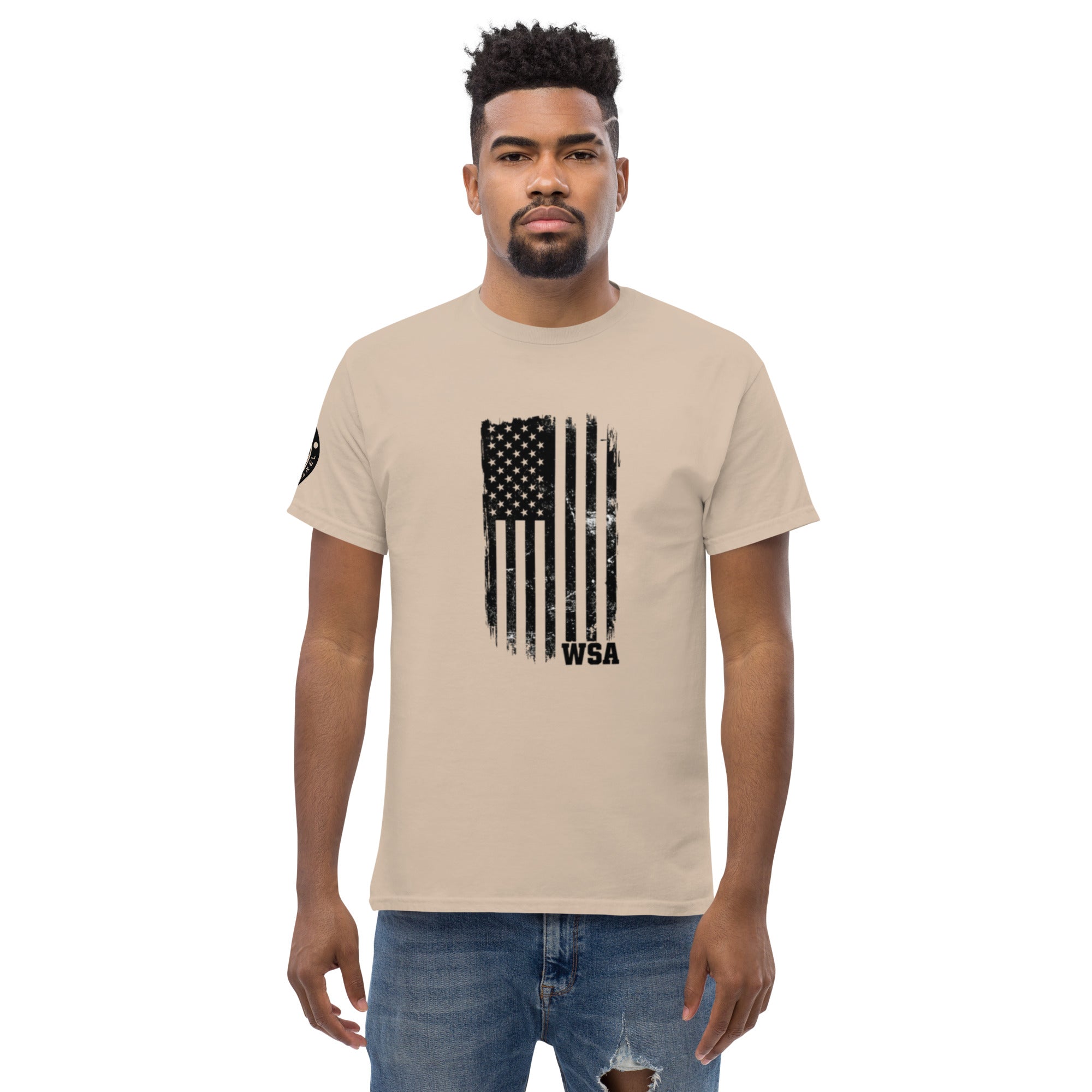 Man wearing a beige t-shirt with a black American flag graphic and 'WSA' text on a white background