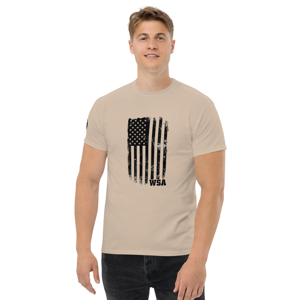 Man wearing a beige t-shirt with an American flag design on a white background