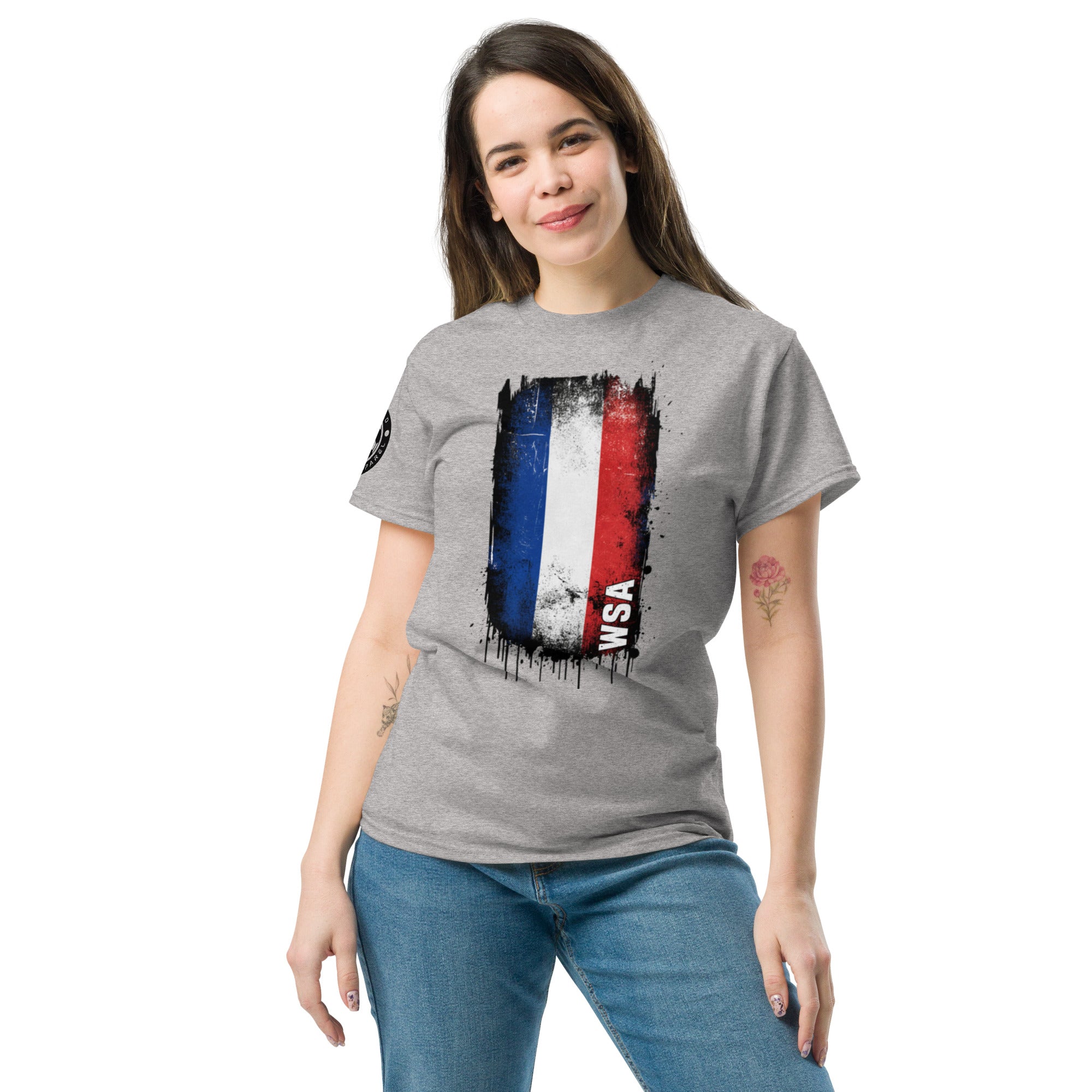 Woman wearing a gray t-shirt with a colorful graphic design on a white background