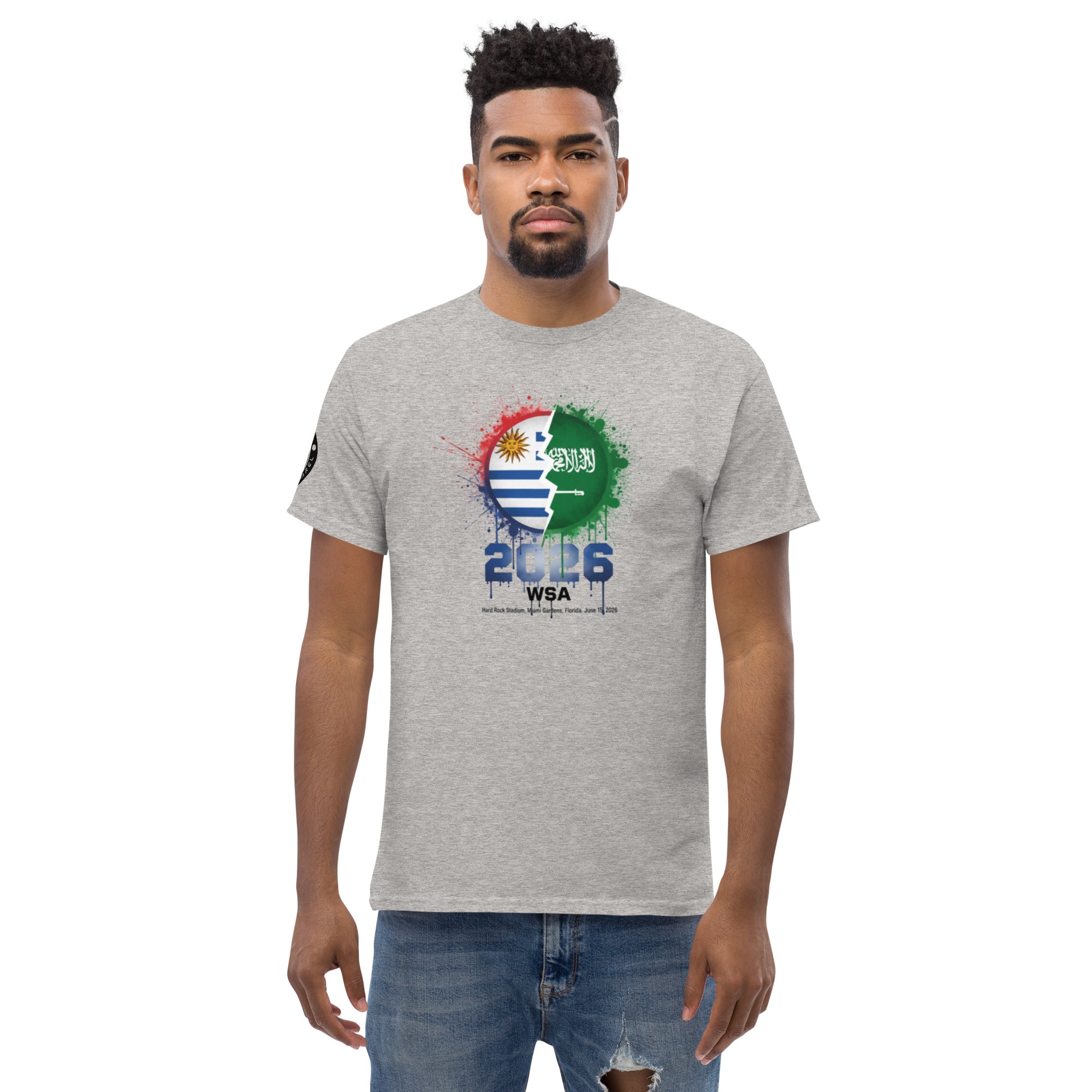 Man wearing a gray t-shirt with a colorful graphic design on a white background
