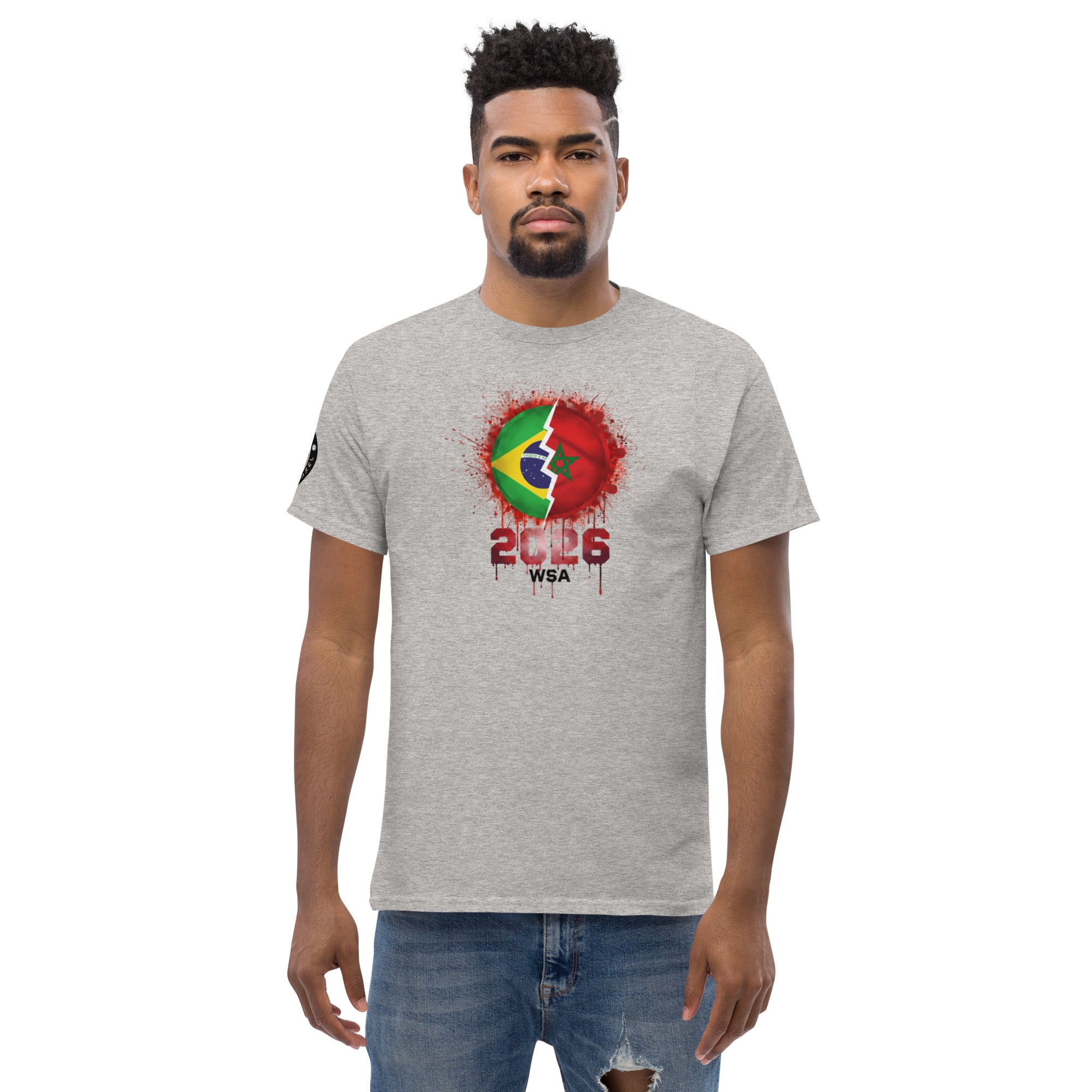 Man wearing a gray t-shirt with a colorful graphic design on a white background