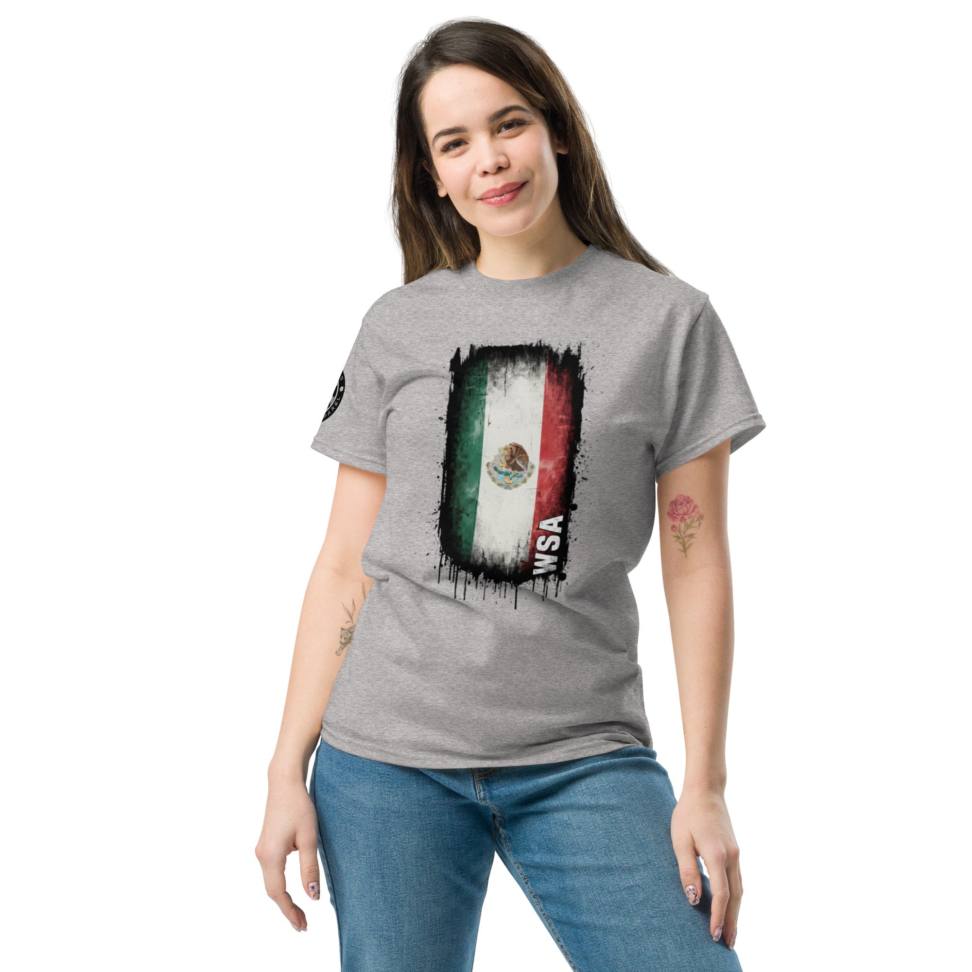 Woman wearing a gray t-shirt with a graphic design on a white background