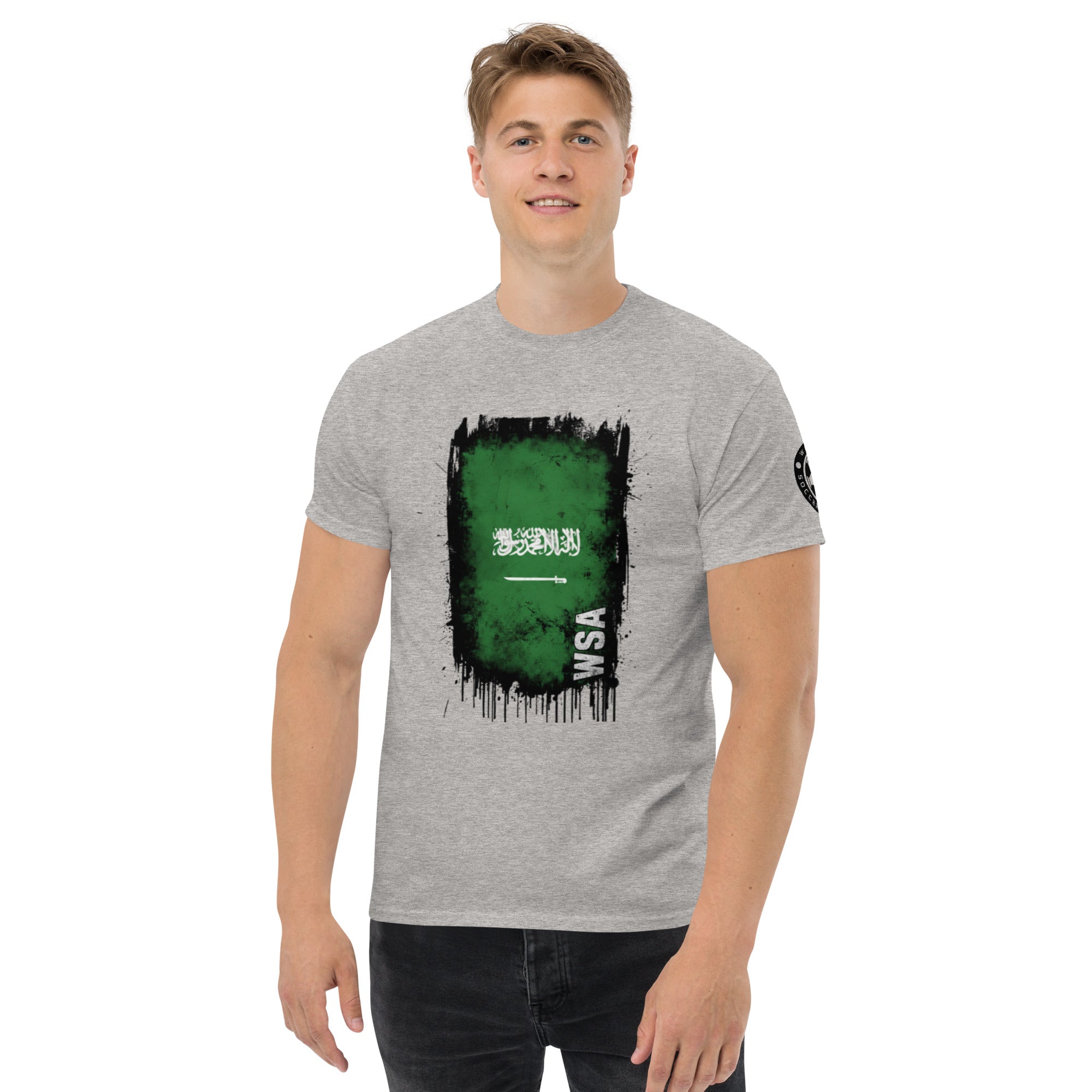 Person wearing a gray t-shirt with a green graphic design on a white background