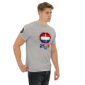 Man wearing a gray t-shirt with a graphic design on a white background
