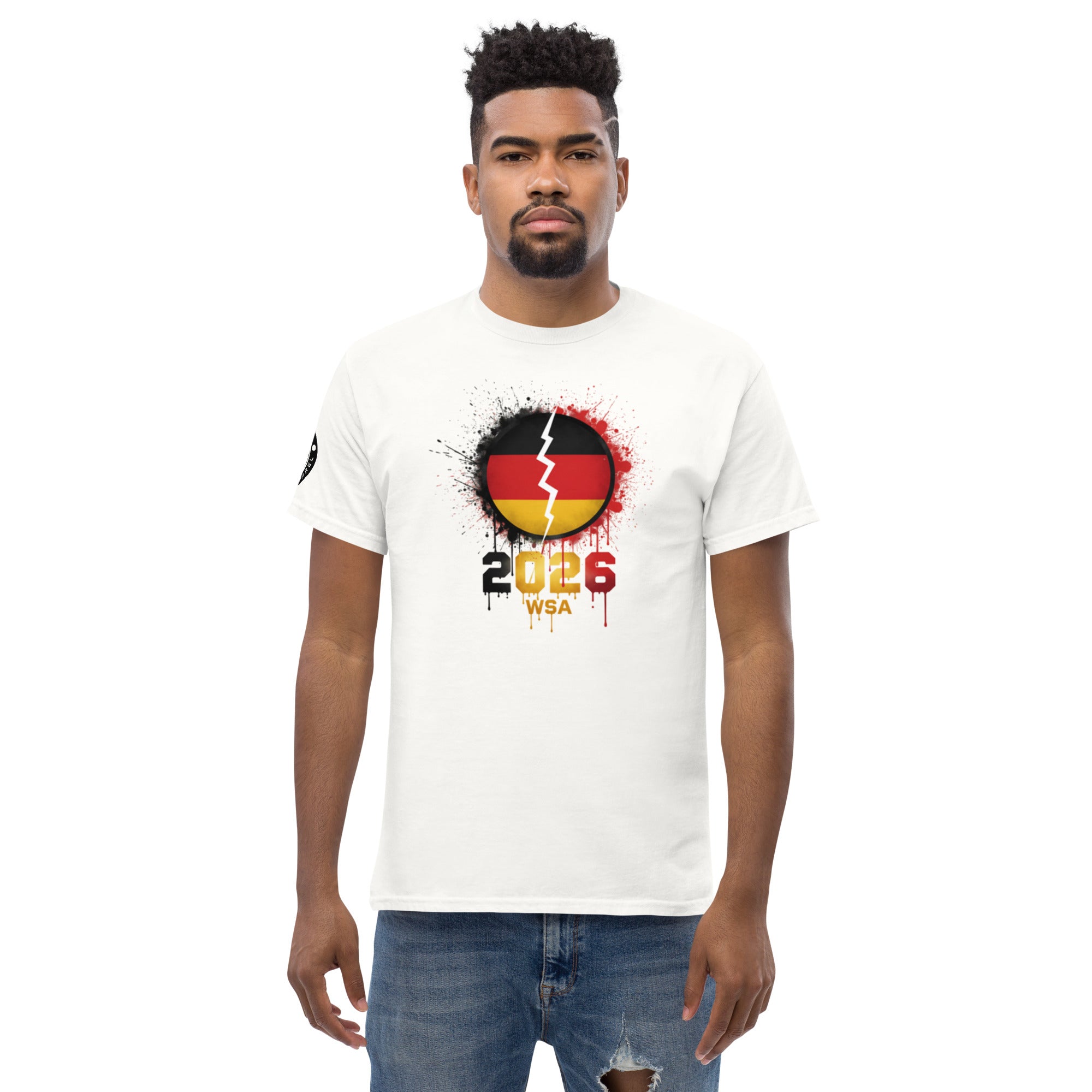 Man wearing a white t-shirt with a design featuring the number 2026 and text on a white background