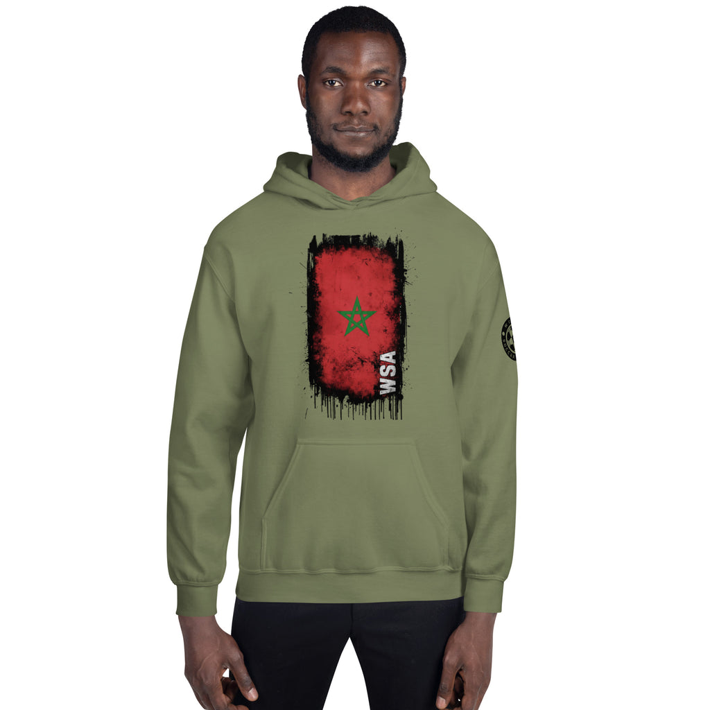 Person wearing a green hoodie with a red and black graphic design on a white background