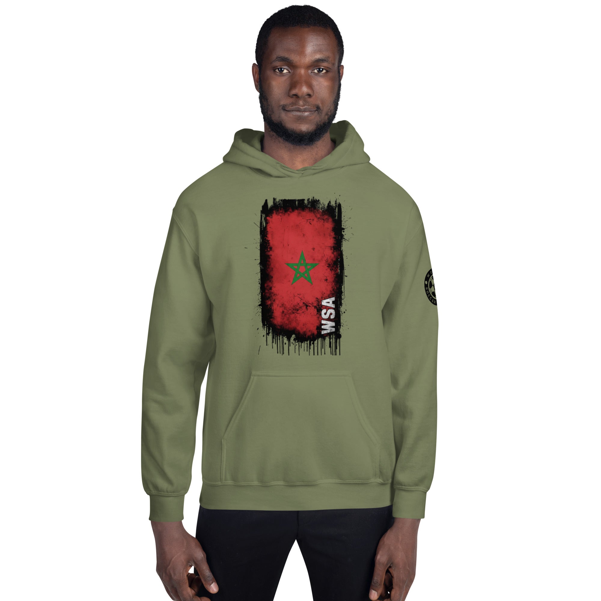 Person wearing a green hoodie with a red and black graphic design on a white background
