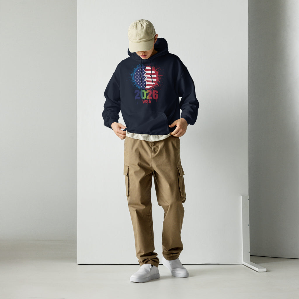 Person wearing a navy hoodie with a graphic design, beige cap, and brown cargo pants on a white background