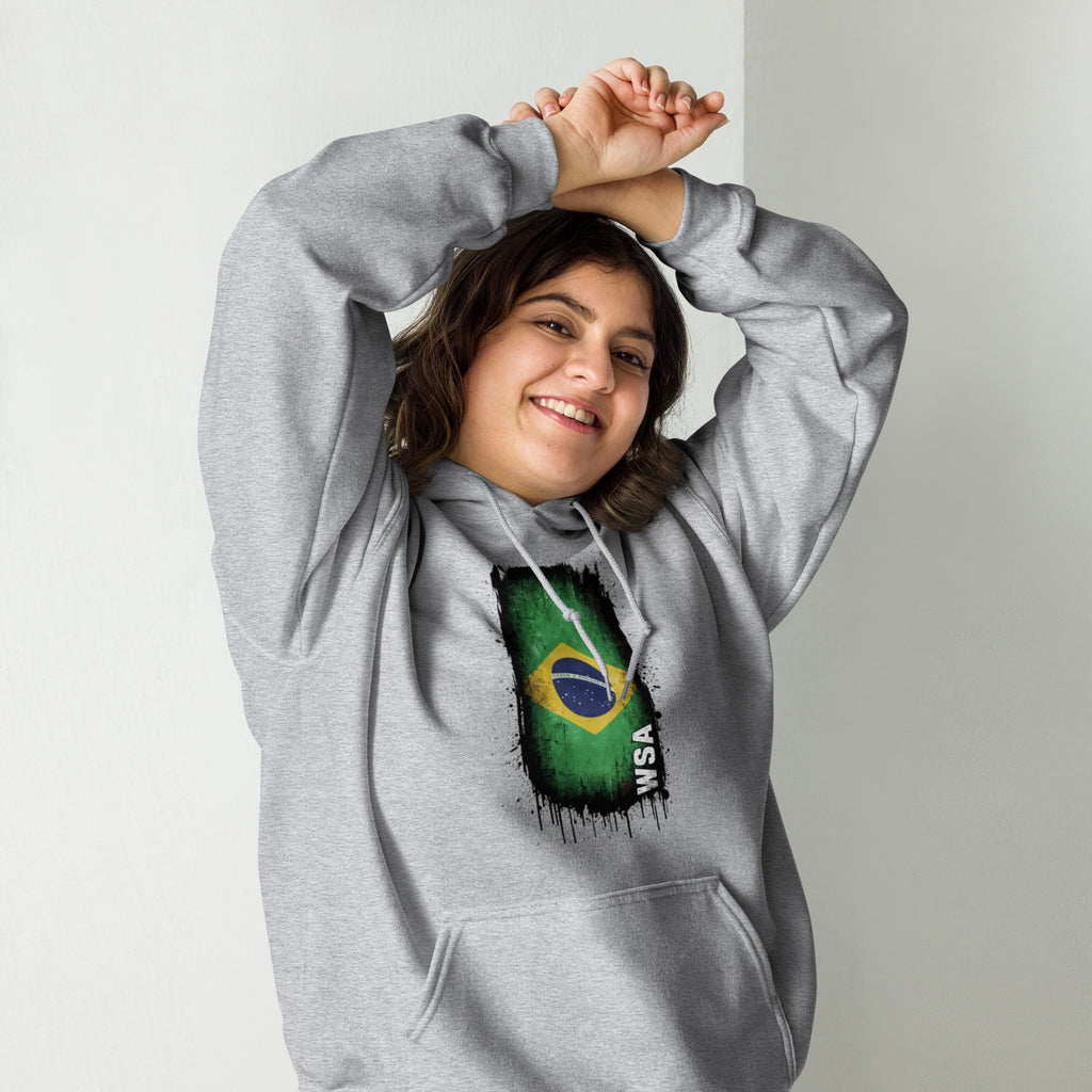 Person wearing a gray hoodie with a Brazilian flag design on a plain background