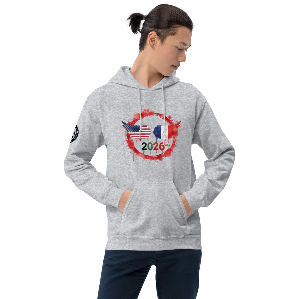 Person wearing a gray hoodie with a design featuring flags and the number 2026 on a white background