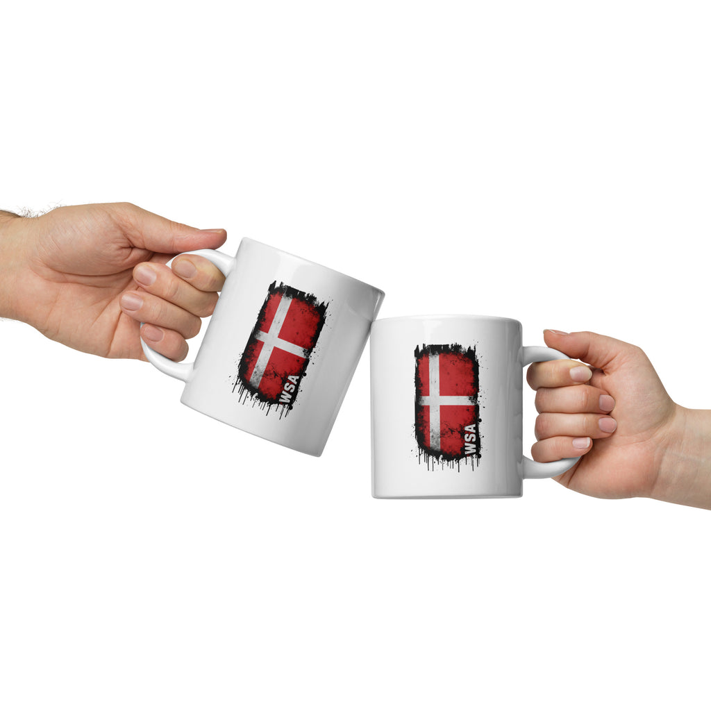 Two hands holding mugs with Danish flags on a white background